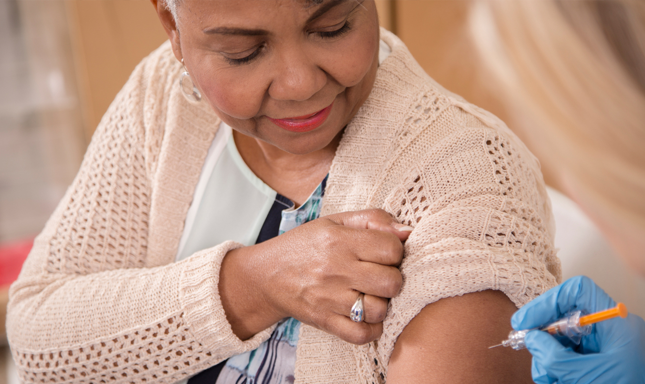 woman receiving flu shot