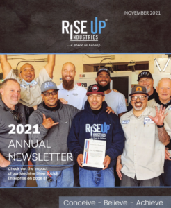 nine men posing for RiseUp annual newsletter