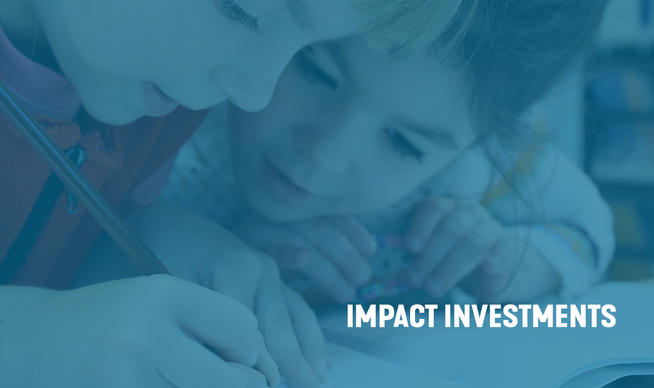 two children focused on writing, impact investments