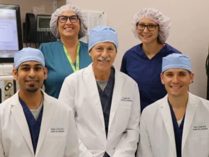 group of doctors with safety head coverings