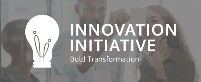 logo_i2 over image of 3 diverse people brainstorming on a window