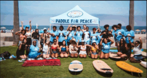 paddle for peace_group of kids at the beach